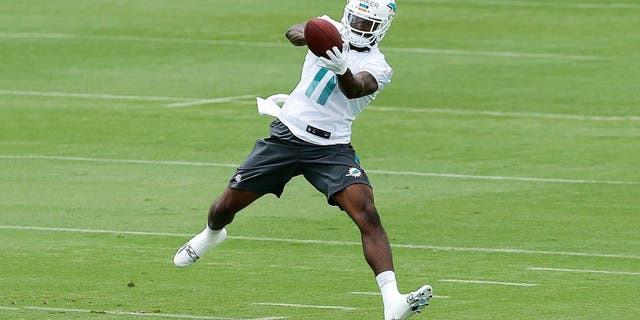 DAVIE, FL - MAY 26: DeVante Parker #11 of the Miami Dolphins catches the ball during the teams first OTA's on May 26, 2015 at the Miami Dolphins training facility in Davie, Florida. (Photo by Joel Auerbach/Getty Images)