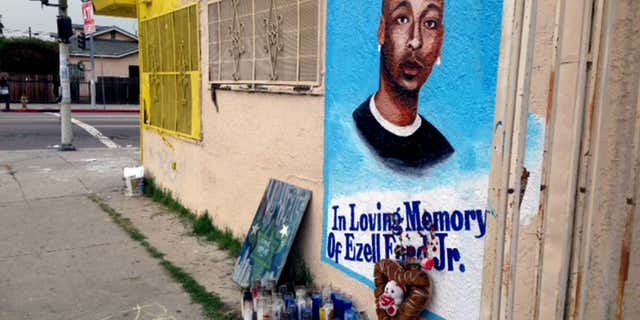Dec. 30, 2014: a street side memorial with a painted portrait of Ezell Ford near where he was shot when police confronted him on Aug. 11, 2014, is shown on a street near his home in South Los Angeles.