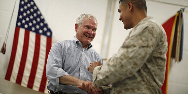June 5: U.S. Secretary of Defense Robert Gates, left, talks with a U.S. Marine at Forward Operating Base (FOB) Dwyer, Afghanistan.