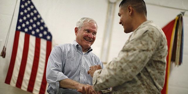 June 5: U.S. Secretary of Defense Robert Gates, left, talks with a U.S. Marine at Forward Operating Base (FOB) Dwyer, Afghanistan.