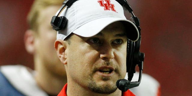 Dec 31, 2015; Atlanta, GA, USA; Houston Cougars head coach Tom Herman looks on from the sidelines against the Florida State Seminoles in the fourth quarter in the 2015 Chick-fil-A Peach Bowl at the Georgia Dome. The Cougars won 38-24. Mandatory Credit: Brett Davis-USA TODAY Sports