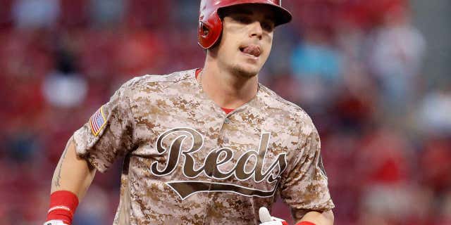 Cincinnati Reds' Scooter Gennett runs the bases after hitting a two-run home run off St. Louis Cardinals relief pitcher John Gant in the fourth inning of a baseball game, Tuesday, June 6, 2017, in Cincinnati.