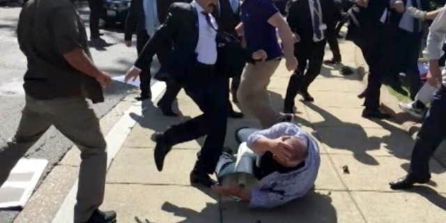 In this frame grab from video provided by Voice of America, members of Turkish President Recep Tayyip Erdogan’s security detail are shown violently reacting to peaceful protesters during Erdogan's trip last month to Washington.