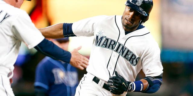 Jun 6, 2015; Seattle, WA, USA; Seattle Mariners center fielder Austin Jackson (16) runs around the bases after hitting a solo-homer against the Tampa Bay Rays during the eighth inning at Safeco Field. Mandatory Credit: Jennifer Buchanan-USA TODAY Sports