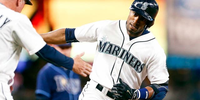 Jun 6, 2015; Seattle, WA, USA; Seattle Mariners center fielder Austin Jackson (16) runs around the bases after hitting a solo-homer against the Tampa Bay Rays during the eighth inning at Safeco Field. Mandatory Credit: Jennifer Buchanan-USA TODAY Sports