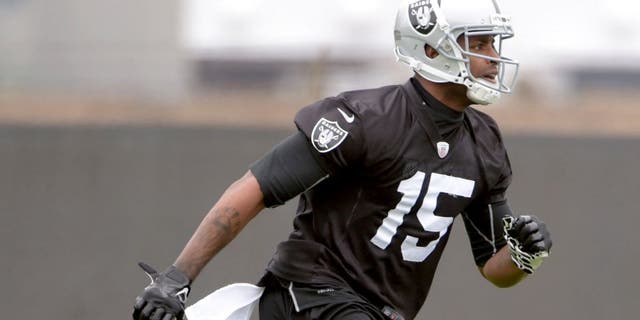 May 26, 2015; Alameda, CA, USA; Oakland Raiders receivefr Michael Crabtree (15) at organized team activities at the Raiders practice facility. Mandatory Credit: Kirby Lee-USA TODAY Sports