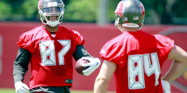 May 28, 2015; Tampa, FL, USA; Tampa Bay Buccaneers tight end Austin Seferian-Jenkins (87) and tight end Cameron Brate (84) smile as they work out at One Buc Place. Mandatory Credit: Kim Klement-USA TODAY Sports
