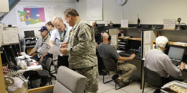 Volunteer radio operators participate in an earthquake and tsunami readiness drill, Tuesday, June 7, 2016, at Camp Murray, Wash.