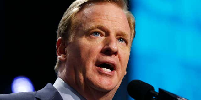 FILE - In this Thursday, April 28, 2016 file photo, NFL commissioner Roger Goodell announces a selection during the first round of the 2016 NFL football draft in Chicago.