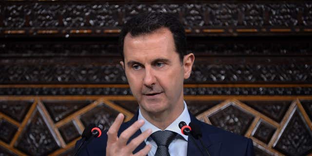June 7, 2016: In this photo released by the Syrian official news agency SANA, Syrian President Bashar Assad, addresses a speech to the newly-elected parliament at the parliament building, in Damascus, Syria.