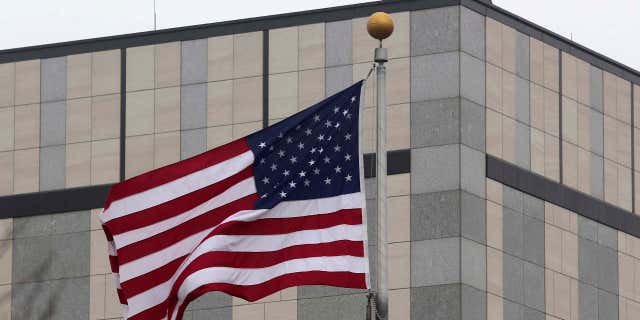 Guards are seen on the roof of the U.S. embassy in Kiev.