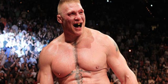 (L-R) Brock Lesnar throws a right to the face of Shane Carwin during the UFC Heavyweight Championship Unification bout at the MGM Grand Garden Arena on July 3, 2010 in Las Vegas, Nevada.