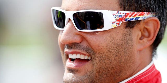 BROOKLYN, MI - AUGUST 13: Juan Pablo Montoya, driver of the #42 Target Chevrolet, looks on from the grid during qualifying for the NASCAR Sprint Cup Series CARFAX 400 at Michigan International Speedway on August 13, 2010 in Brooklyn, Michigan. (Photo by Jeff Zelevansky/Getty Images for NASCAR)
