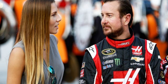 BRISTOL, TN - AUGUST 22: Kurt Busch, driver of the #41 Haas Automation Chevrolet, talks to his girlfriend, Ashley Van Metre, prior to the NASCAR Sprint Cup Series IRWIN Tools Night Race at Bristol Motor Speedway on August 22, 2015 in Bristol, Tennessee. (Photo by Jeff Zelevansky/Getty Images)