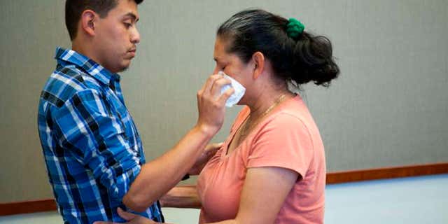 June 9, 2016: Steve Hernandez wipes a tear from his mother's eye after seeing her for the first time in 20 years in San Diego, Calif..