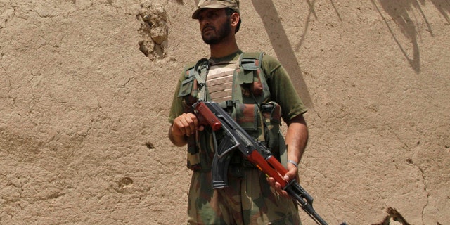 June 9: A Pakistan army soldier stands guard at the site of a blast in Matani near Peshawar, Pakistan.