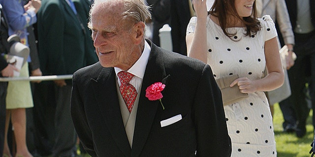 June 4: Britain's Prince Philip, the Duke of Edinburgh, left, and Princess Eugenie arrive on Derby Day at Epsom Downs Racecourse in Epsom, England.