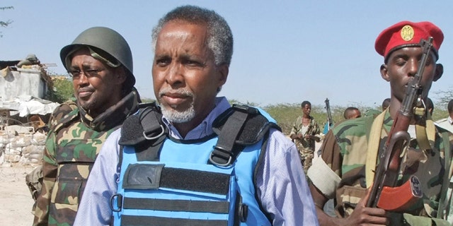 Feb. 23: Somalia's Interior Minister Abdishakur Sheik Hassan, center, is escorted by Somali soldiers in Mogadishu, Somalia.