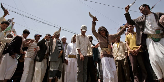June 9: Anti-government protestors dance holding up daggers during a demonstration demanding the resignation of Yemeni President Ali Abdullah Saleh, in Sanaa, Yemen.