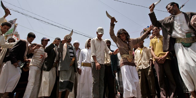 June 9: Anti-government protestors dance holding up daggers during a demonstration demanding the resignation of Yemeni President Ali Abdullah Saleh, in Sanaa, Yemen.