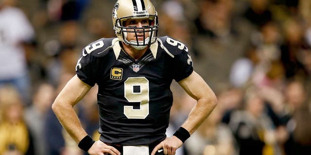 Dec 29, 2013; New Orleans, LA, USA; New Orleans Saints quarterback Drew Brees (9) prior to kickoff of a game against the Tampa Bay Buccaneers at the Mercedes-Benz Superdome. Mandatory Credit: Derick E. Hingle-USA TODAY Sports