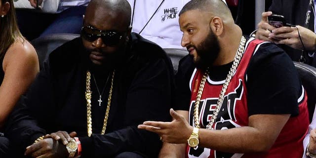 Jun 10, 2014; Miami, FL, USA; Recording artists Rick Ross (left) and DJ Khaled (right) watch the game between the Miami Heat and the San Antonio Spurs during the second half of game three of the 2014 NBA Finals at American Airlines Arena. Mandatory Credit: Bob Donnan-USA TODAY Sports