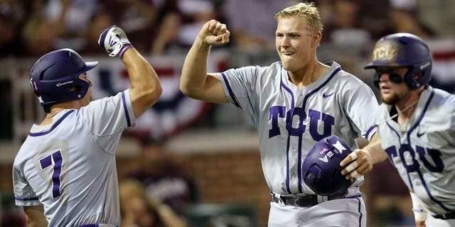 TCU's Luken Baker (19) celebrates with teammate Josh Watson (7) after a three run homer against Texas A&M during the third inning of an NCAA Super Regional baseball tournament game, Friday, June 10, 2016, in College Station, Texas. (AP Photo/Sam Craft)