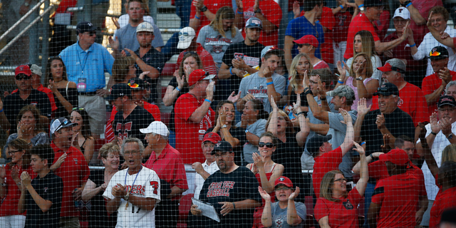 Texas Tech fans celebrate after Michael Davis hit a home run during an NCAA college baseball tournament super regional game against East Carolina, Friday, June 10, 2016, in Lubbock, Texas. (Brad Tollefson/Lubbock Avalanche-Journal via AP) ALL LOCAL TELEVISION OUT; MANDATORY CREDIT