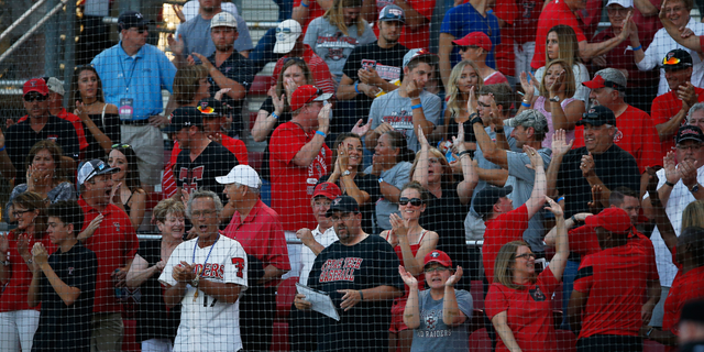 Texas Tech fans celebrate after Michael Davis hit a home run during an NCAA college baseball tournament super regional game against East Carolina, Friday, June 10, 2016, in Lubbock, Texas. (Brad Tollefson/Lubbock Avalanche-Journal via AP) ALL LOCAL TELEVISION OUT; MANDATORY CREDIT