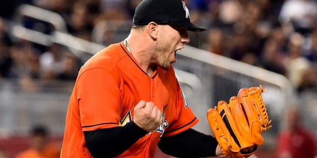 Jun 5, 2016; Miami, FL, USA; Miami Marlins starting pitcher Jose Fernandez (16) reacts on the pitchers mound during the seventh inning against the New York Mets at Marlins Park. The Marlins won 1-0. Mandatory Credit: Steve Mitchell-USA TODAY Sports