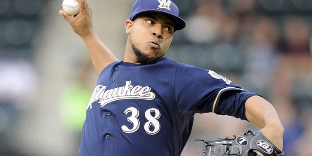 Milwaukee Brewers pitcher Wily Peralta delivers the ball to the New York Mets during the first inning of a baseball game on Wednesday, June 11, 2014, at Citi Field in New York. (AP Photo/Bill Kostroun)