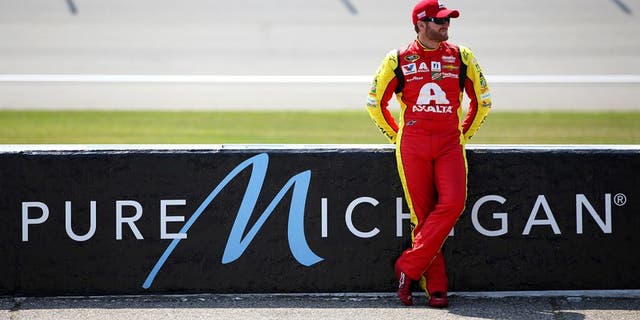 BROOKLYN, MI - JUNE 10: Dale Earnhardt Jr, driver of the #88 Axalta Chevrolet, stands on the grid during qualifying for the NASCAR Sprint Cup Series FireKeepers Casino 400 at Michigan International Speedway on June 10, 2016 in Brooklyn, Michigan. (Photo by Sean Gardner/NASCAR via Getty Images)