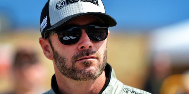 BROOKLYN, MI - JUNE 10: Jimmie Johnson, driver of the #48 Kobalt Chevrolet, stands on the grid during qualifying for the NASCAR Sprint Cup Series FireKeepers Casino 400 at Michigan International Speedway on June 11, 2016 in Brooklyn, Michigan. (Photo by Drew Hallowell/Getty Images )