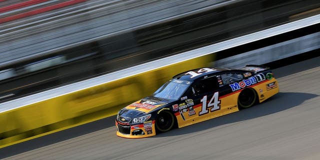 BROOKLYN, MI - JUNE 10: Tony Stewart, driver of the #14 Rush Truck Centers/Mobil 1 Chevrolet, drives during qualifying for the NASCAR Sprint Cup Series FireKeepers Casino 400 at Michigan International Speedway on June 11, 2016 in Brooklyn, Michigan. (Photo by Daniel Shirey/NASCAR via Getty Images)