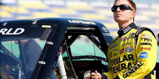 KANSAS CITY, KS - APRIL 21: Jason Leffler, driver of the #18 Shore Lodge Toyota, looks on during qualifying for NASCAR Camping World Truck Series SFP 250 at Kansas Speedway on April 21, 2012 in Kansas City, Kansas. (Photo by Geoff Burke/Getty Images for NASCAR)