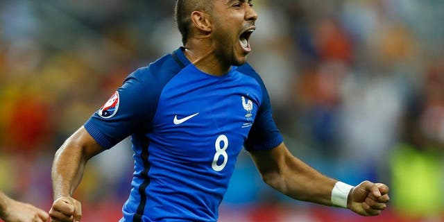 PARIS, FRANCE - JUNE 10: Dimitri Payet of France celebrates scoring his team's second goal during the UEFA Euro 2016 Group A match between France and Romania at Stade de France on June 10, 2016 in Paris, France. (Photo by Clive Rose/Getty Images)