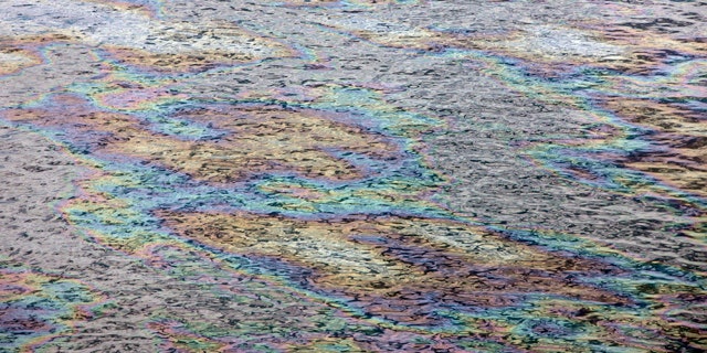 June 13: The surface of the Gulf of Mexico glistens with color as light reflects off the oil sheen at the site of the Deepwater Horizon oil spill in the Gulf of Mexico.