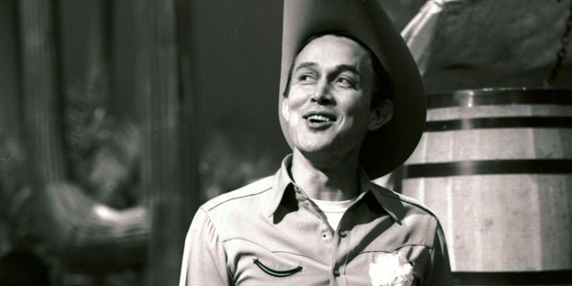 April 2, 1964: Jimmy Dean smiles while he gets ready for a taping of his show "The Jimmy Dean Show" in New York.