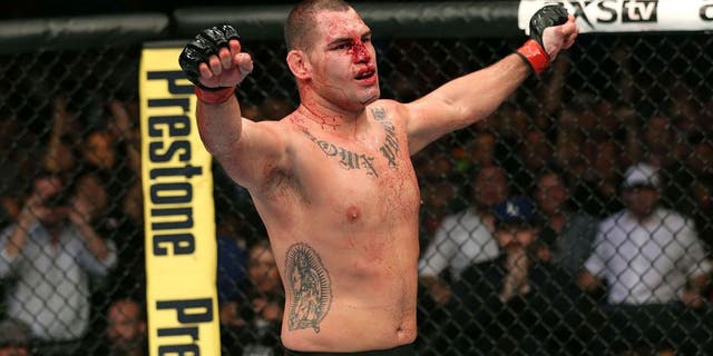 HOUSTON, TEXAS - OCTOBER 19: Cain Velasquez celebrates after defeating Junior Dos Santos (not pictured) by TKO in their UFC heavyweight championship bout at the Toyota Center on October 19, 2013 in Houston, Texas. (Photo by Nick Laham/Zuffa LLC/Zuffa LLC via Getty Images)