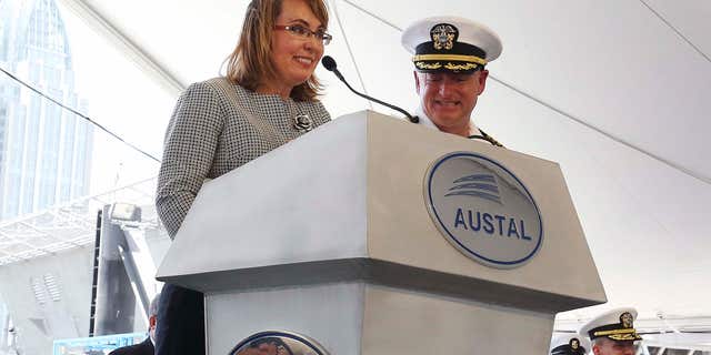 June 13, 2015: Former U.S. Rep. Gabrielle Giffords of Arizona delivers remarks with her husband, retired U.S. Navy Capt. Mark Kelly, by her side as the USS Gabrielle Giffords, a littoral combat ship built at the Austal USA shipyards is christened during a ceremony.