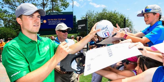PONTE VEDRA BEACH, FL - MAY 10: Jordan Spieth signs autographs for fans ahead of THE PLAYERS Championship on THE PLAYERS Stadium Course at TPC Sawgrass on May 10, 2016. (Photo by Ryan Young/PGA TOUR)