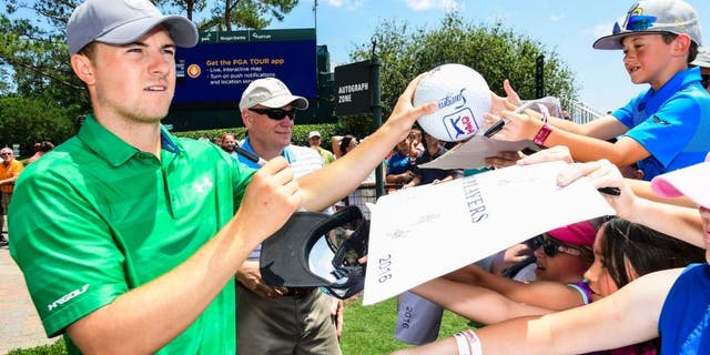 PONTE VEDRA BEACH, FL - MAY 10: Jordan Spieth signs autographs for fans ahead of THE PLAYERS Championship on THE PLAYERS Stadium Course at TPC Sawgrass on May 10, 2016. (Photo by Ryan Young/PGA TOUR)