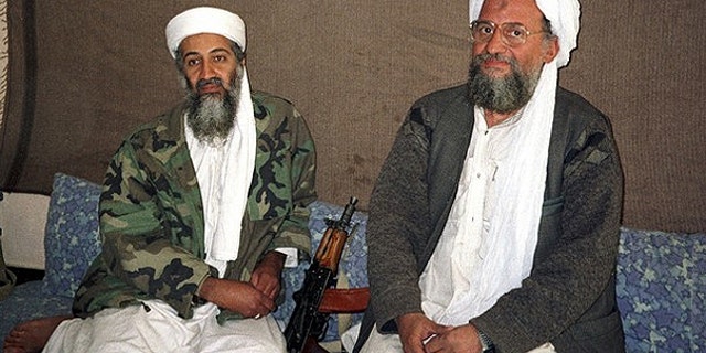 Nov. 10, 2001: Usama bin Laden sits with his adviser and purported successor Ayman al-Zawahiri, an Egyptian linked to the Al Qaeda network, during an interview with Pakistani journalist Hamid Mir (not pictured) in an image supplied by the respected Dawn newspaper.