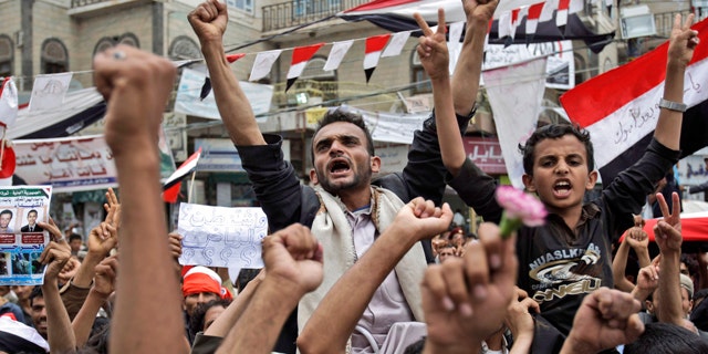 June 15: Anti-government protestors chant slogans during a demonstration demanding the resignation of Yemeni President Ali Abdullah Saleh, in Sanaa, Yemen.