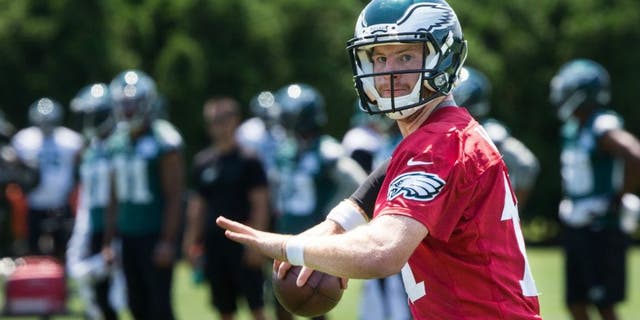 Jun 9, 2016; Philadelphia, PA, USA; Philadelphia Eagles quarterback Carson Wentz (11) passes during mini camp at NovaCare Complex. Mandatory Credit: Bill Streicher-USA TODAY Sports