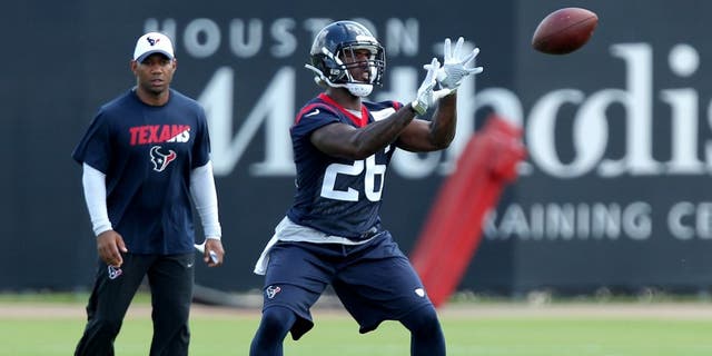 Jun 14, 2016; Houston, TX, USA; Houston Texans running back Lamar Miller (26) catches a short pass in offensive drills during Houston Texans minicamp at Methodist Training Center in Houston, TX. Mandatory Credit: Erik Williams-USA TODAY Sports