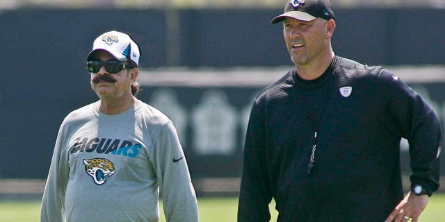 Jun 16, 2015; Jacksonville, FL, USA; Jacksonville Jaguars owner Shad Khan (left) and head coach Gus Bradley during minicamp at the Florida Blue Health and Wellness Practice Fields. Mandatory Credit: Phil Sears-USA TODAY Sports