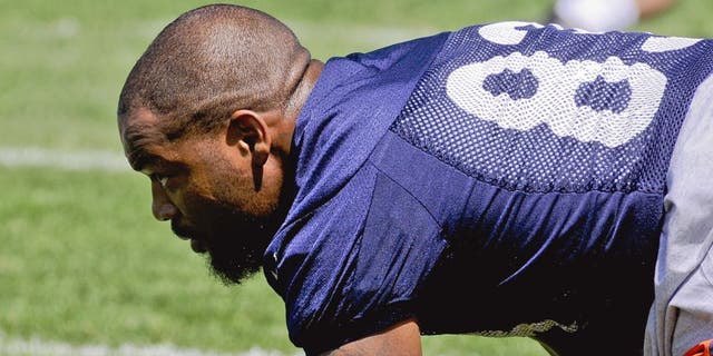 Chicago Bears tight end Martellus Bennett stretches during NFL football minicamp at Halas Hall, Tuesday, June 16, 2015, in Lake Forest, Ill. (AP Photo/Matt Marton)
