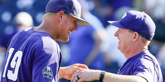 TCU's Luken Baker, left, celebrates with coach Jim Schlossnagle, right, following an NCAA men's College World Series baseball game against Texas Tech in Omaha, Neb., Sunday, June 19, 2016. Baker hit a go-ahead three-run home run in the top of the ninth and TCU won 5-3. (AP Photo/Nati Harnik)
