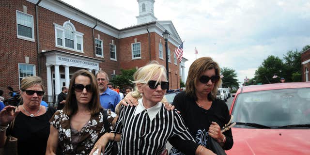 June 16, 2015: Ex-Baltimore Ravens cheerleader Molly Shattuck leaves Delaware courthouse.